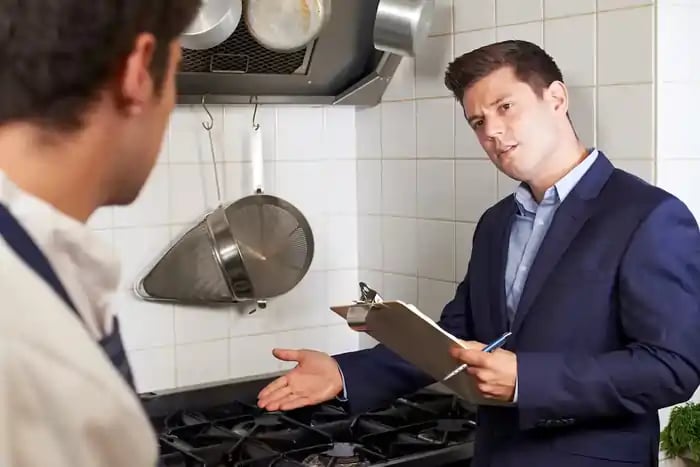 health inspector meeting with chef