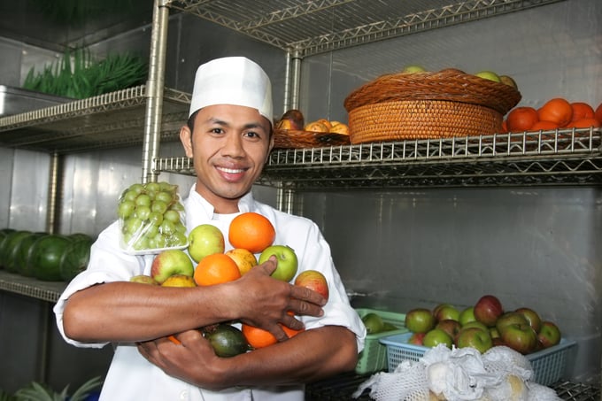 Chef holding fruits in storage