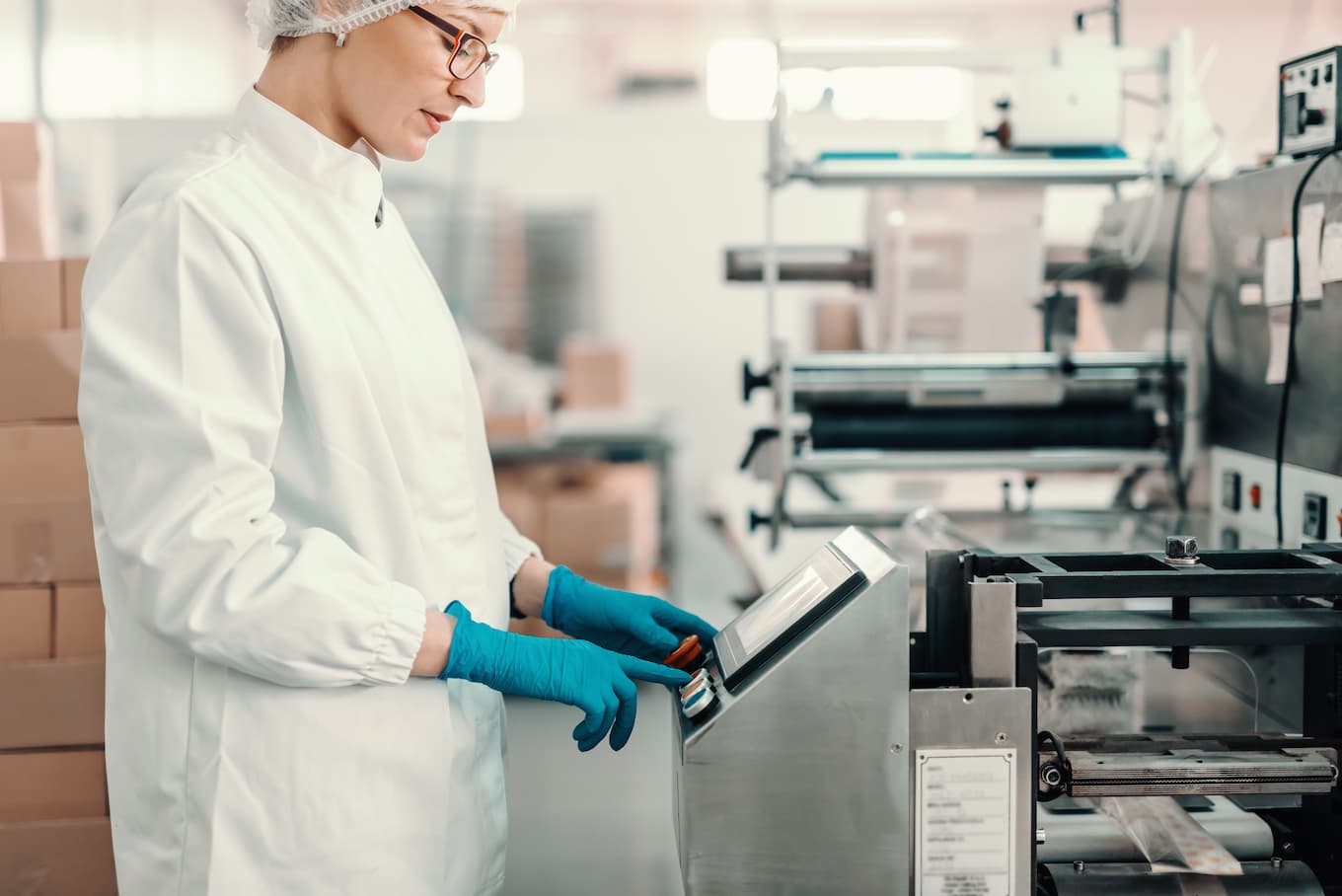 Food worker working using good manufacturing practices