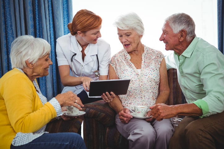 Nurse pointing and showing the screen of a digital