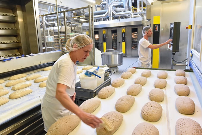 Worker in a large bakery